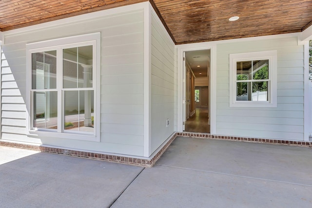 property entrance featuring a patio