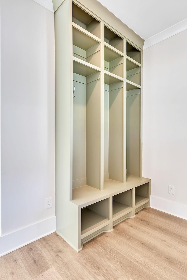 mudroom with light wood-type flooring and baseboards