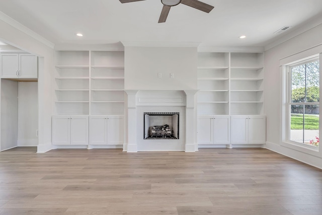 unfurnished living room with light wood-type flooring, a fireplace, visible vents, and recessed lighting