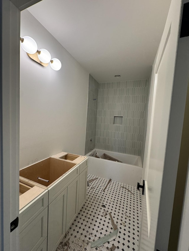 bathroom with tub / shower combination and tile patterned flooring