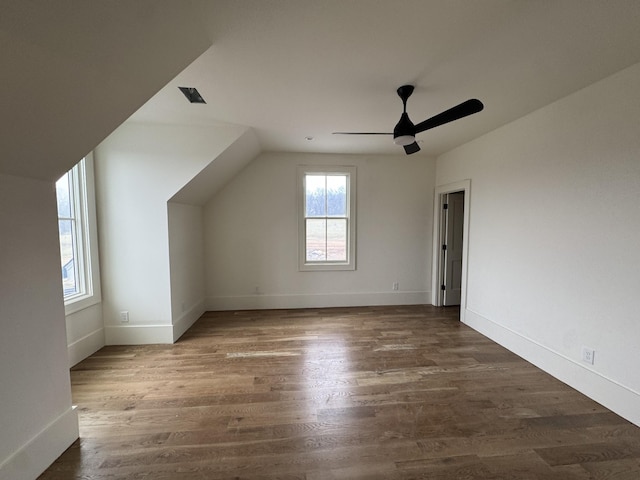 bonus room featuring visible vents, ceiling fan, baseboards, and wood finished floors