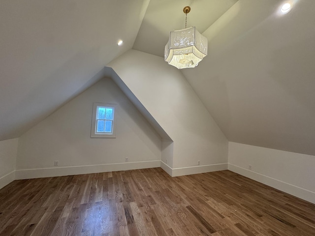 bonus room featuring vaulted ceiling, recessed lighting, wood finished floors, and baseboards