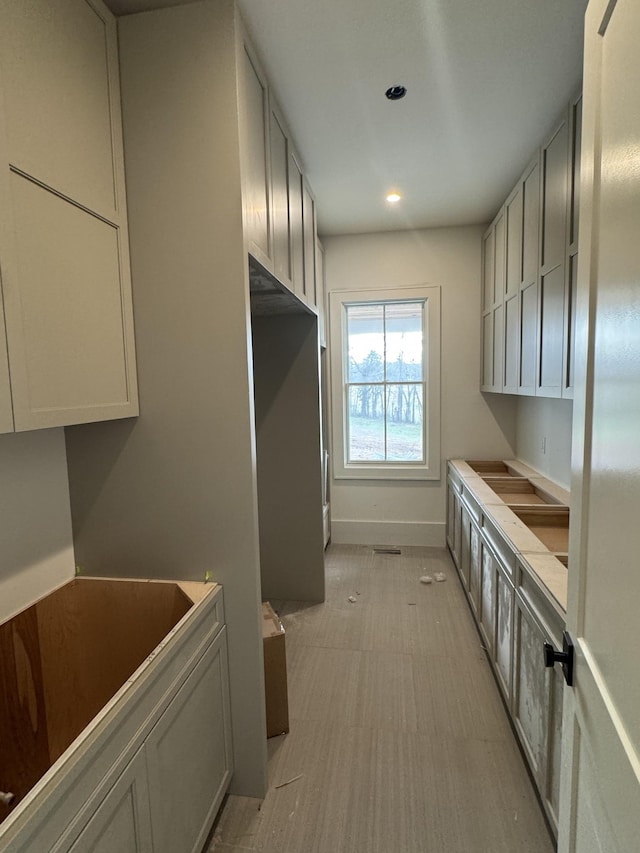 kitchen with recessed lighting and baseboards