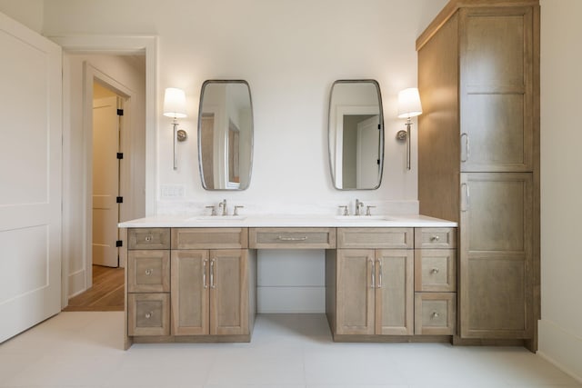 bathroom with double vanity and a sink