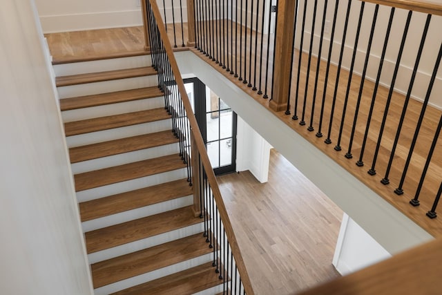 staircase featuring wood finished floors