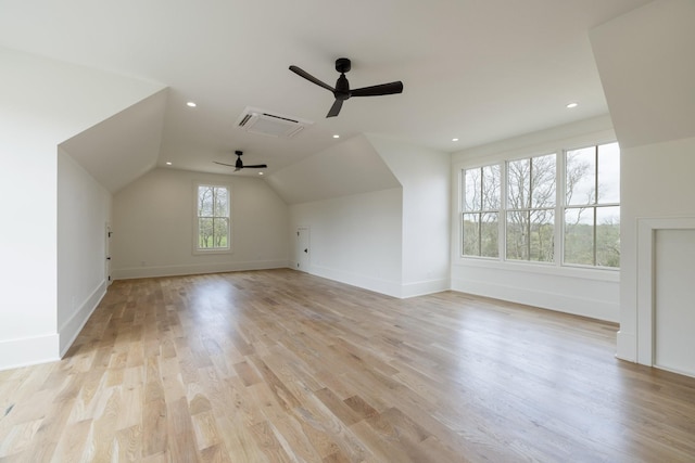 bonus room featuring light wood-type flooring, baseboards, lofted ceiling, and ceiling fan