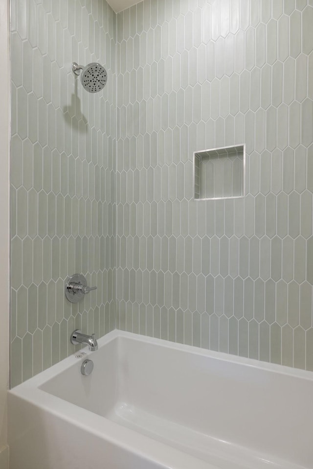 bathroom with shower / washtub combination