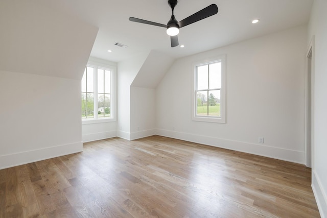 bonus room featuring vaulted ceiling, recessed lighting, baseboards, ceiling fan, and light wood-style flooring