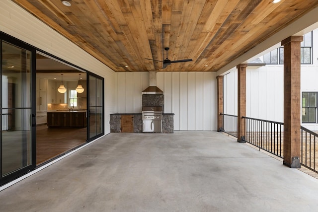 view of patio / terrace featuring a grill, exterior kitchen, a sink, and ceiling fan