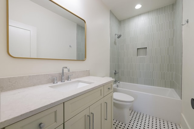 bathroom with toilet, vanity, and washtub / shower combination