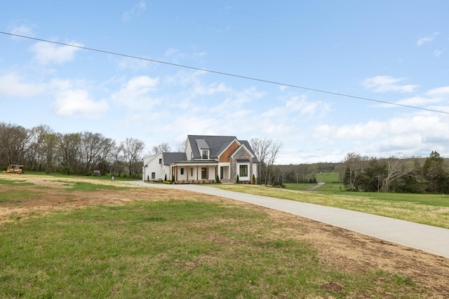 view of front of house with a front lawn and concrete driveway