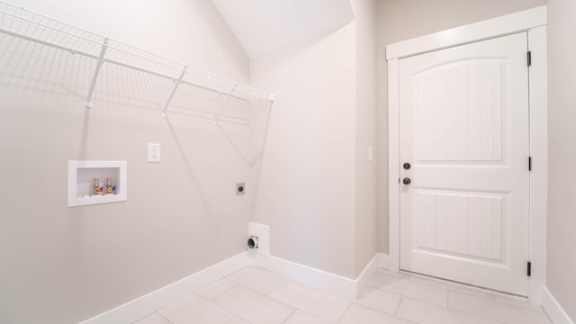 laundry area featuring laundry area, light tile patterned floors, baseboards, hookup for a washing machine, and hookup for an electric dryer