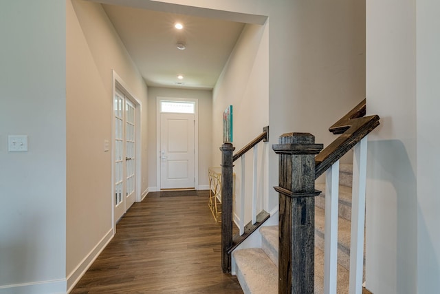 doorway to outside featuring dark wood-style floors, recessed lighting, stairway, and baseboards