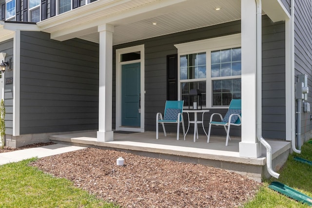 entrance to property featuring covered porch