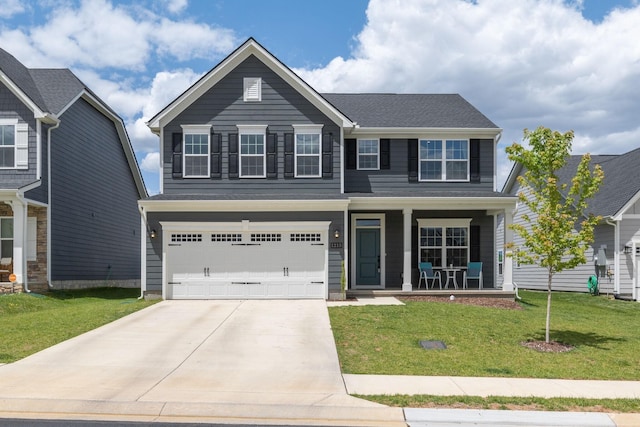 view of front of house featuring covered porch, concrete driveway, a front yard, and an attached garage