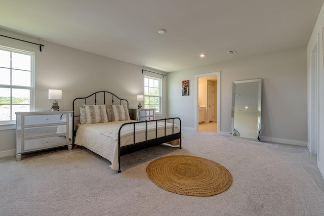 bedroom featuring light carpet, baseboards, and visible vents