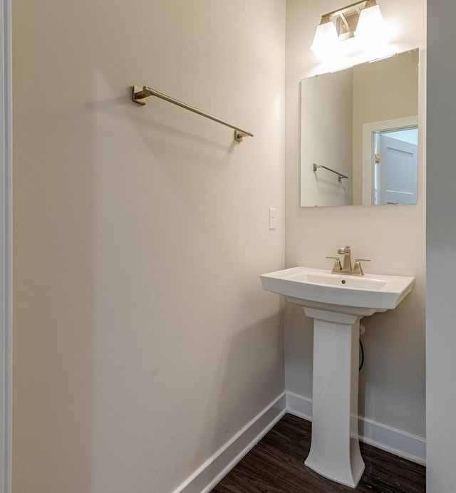 bathroom featuring baseboards and wood finished floors