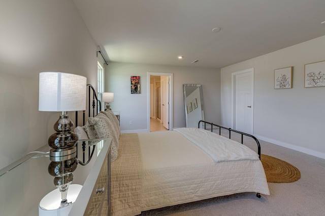 carpeted bedroom with baseboards