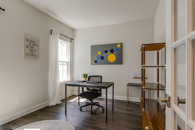 home office with dark wood-style floors and baseboards