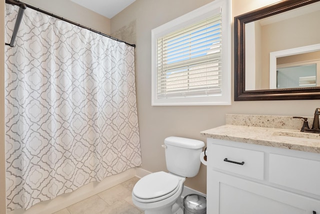 bathroom featuring tile patterned floors, vanity, toilet, and shower / bath combo with shower curtain