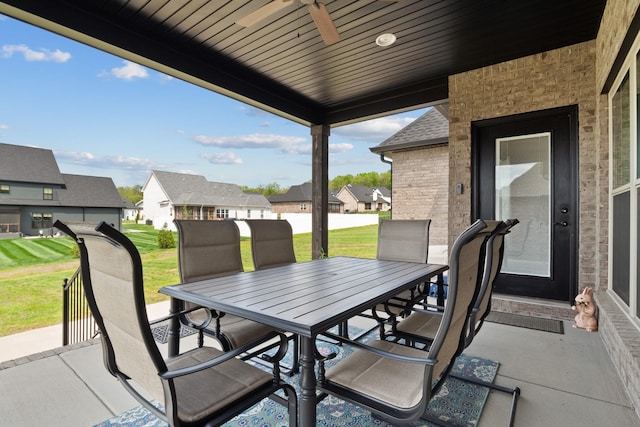 view of patio featuring a residential view and outdoor dining area