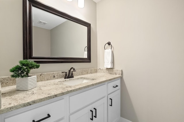 bathroom with visible vents and vanity