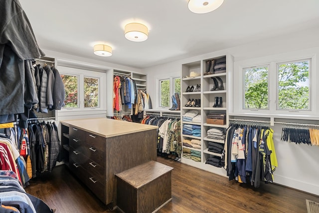 walk in closet with dark wood-style floors and visible vents