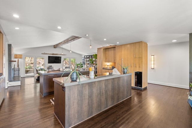 kitchen with a spacious island, open floor plan, lofted ceiling with beams, and dark wood-style floors