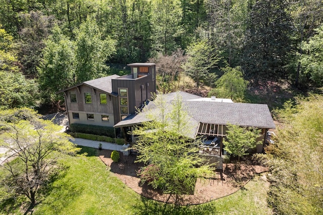 aerial view featuring a view of trees