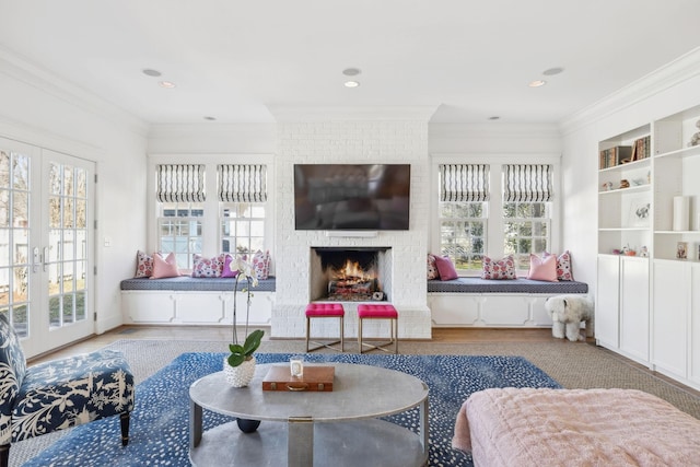 interior space with french doors and a brick fireplace