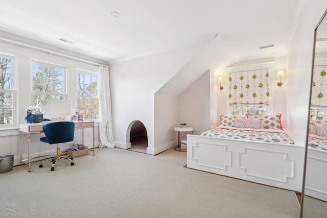 carpeted bedroom featuring visible vents, ornamental molding, and baseboards