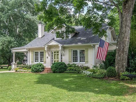 view of front of house featuring a front yard and a chimney