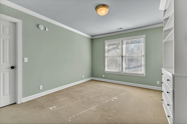 interior space with baseboards, light colored carpet, and crown molding