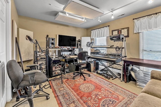 home office featuring visible vents and track lighting