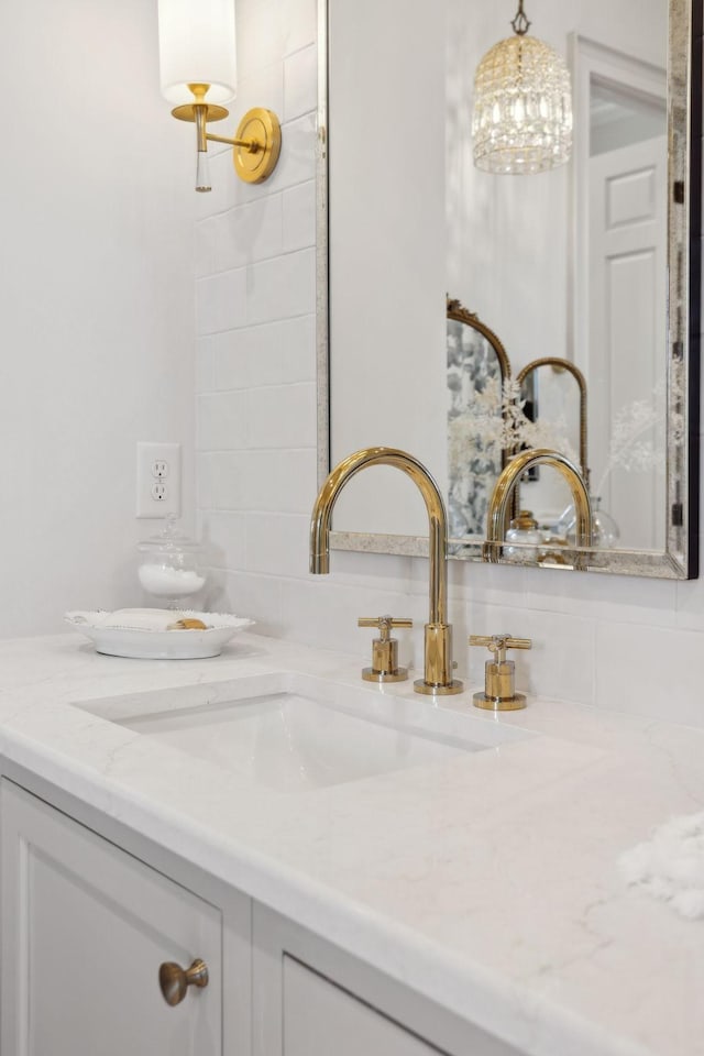 room details featuring tasteful backsplash and vanity