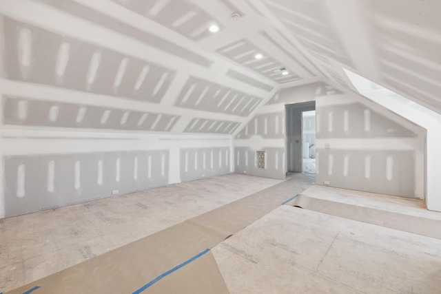 bonus room with lofted ceiling with skylight