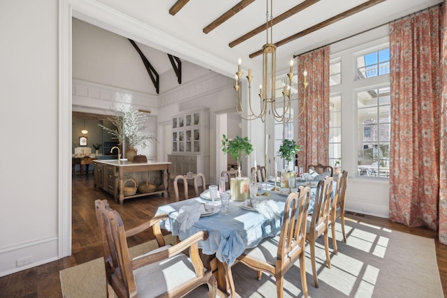 dining space with an inviting chandelier, high vaulted ceiling, dark wood-type flooring, and beam ceiling