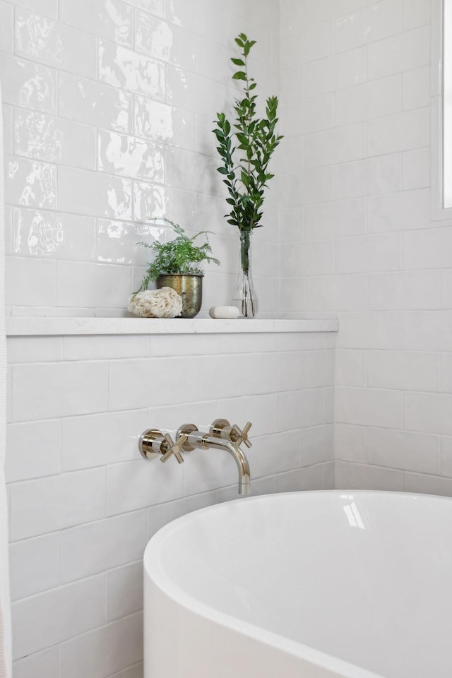 full bath featuring a soaking tub