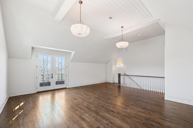 additional living space with visible vents, baseboards, lofted ceiling with beams, wood finished floors, and french doors