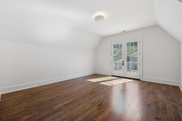 bonus room featuring french doors, visible vents, vaulted ceiling, wood finished floors, and baseboards