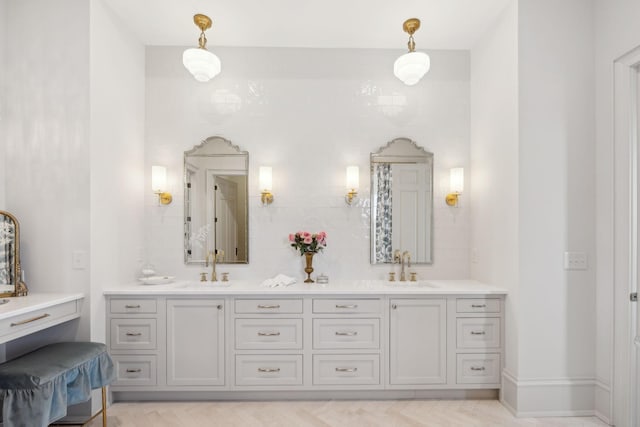 bathroom with double vanity, a sink, and decorative backsplash