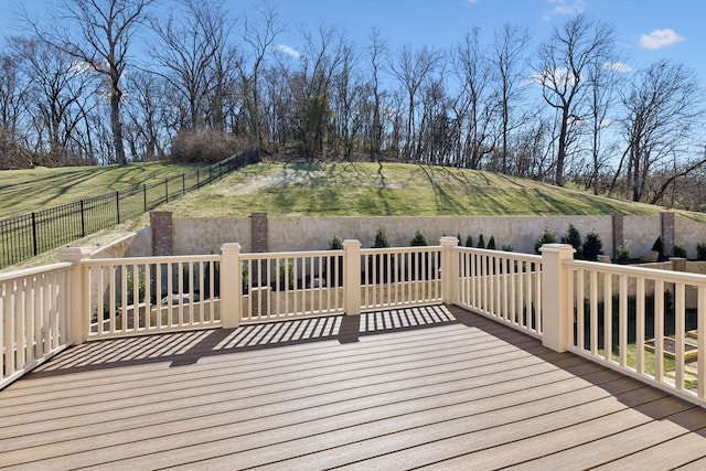 wooden terrace featuring fence