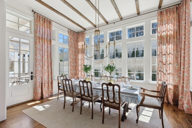 sunroom with beamed ceiling