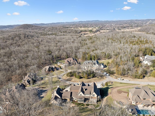 birds eye view of property with a forest view