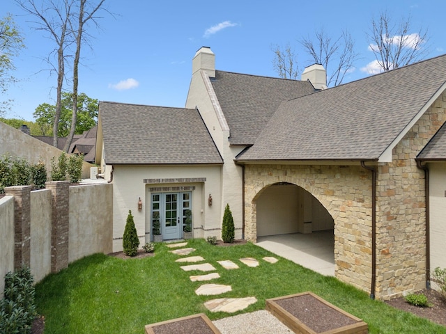 391 The Lady Of The Lake Ln, Franklin, TN 37067 - back of property with a chimney, roof with shingles, and a yard