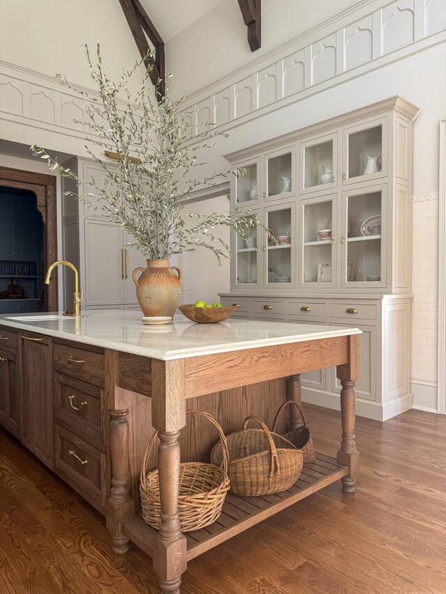 391 The Lady Of The Lake Ln, Franklin, TN 37067 - bar featuring a sink, dark wood-style floors, and a towering ceiling