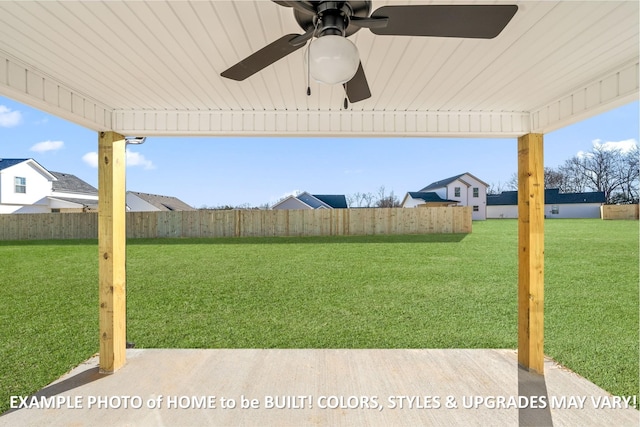 view of yard featuring a ceiling fan and fence