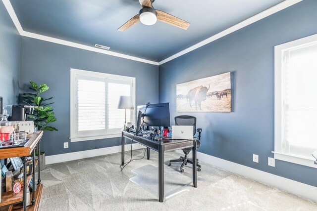 carpeted office featuring baseboards, visible vents, and a ceiling fan