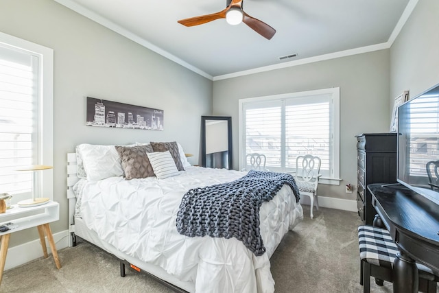 bedroom featuring carpet, multiple windows, and crown molding