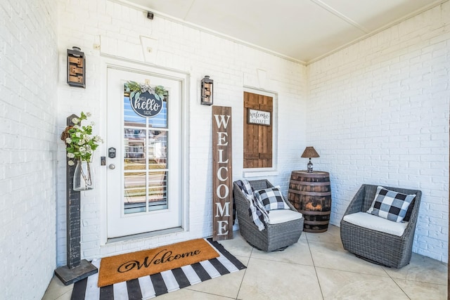 property entrance with brick siding